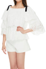 Broderie anglaise cold-shoulder ruffled top